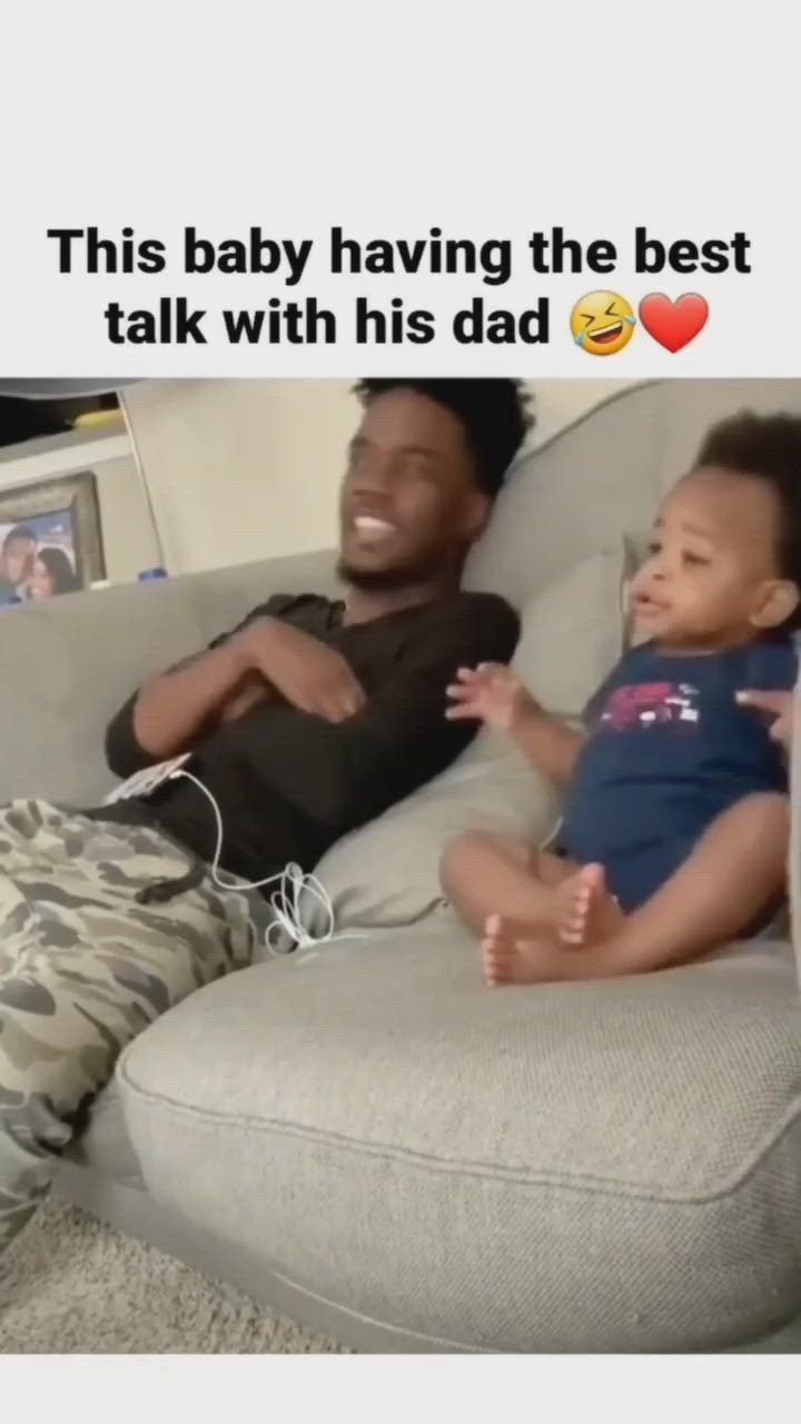 This baby having the best talk with his dad