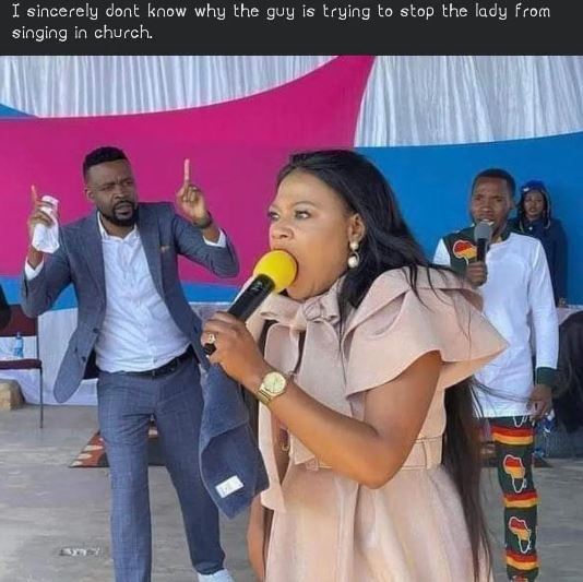 I sincerely dont know why the guy is trying to stop the lady from singing in chu