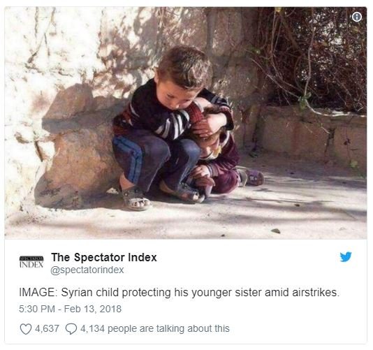 The spectator index spectatorindex image syrian child protecting his younger sis