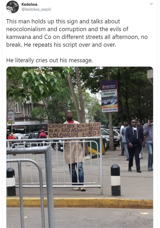 Kedolwa kedolwa_waziri this man holds up this sign and talks about neocolonialis