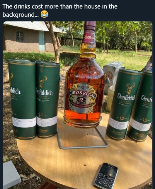 The drinks cost more than the house in the background. nliddich chivas regal adi