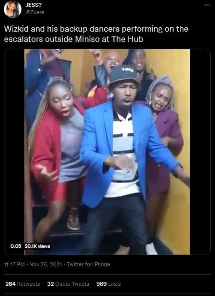 Jess? zuere wizkid and his backup dancers performing on the escalators outside m